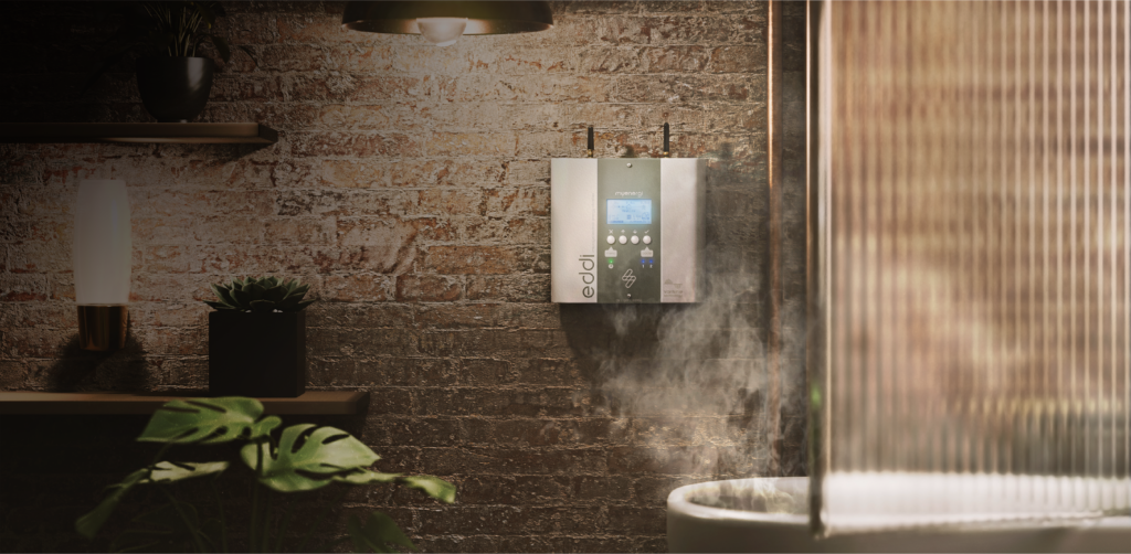 Image of a bath with the eddi hot water diverter behind it | myenergi Ireland
